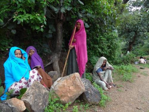 Women take turns to protect pastures from illegal tree felling. 