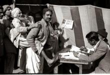 A blind man being carried for voting during 1952 General Elections in Delhi.